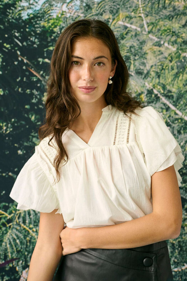 Culture Catinka Cotton Blouse, lightweight and breathable, shown in a relaxed fit with ruffle sleeves and a v neckline.