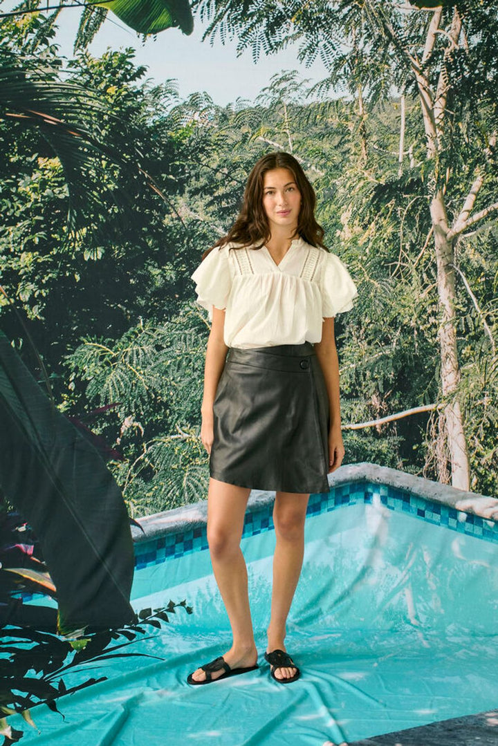 Culture Catinka cotton blouse with a relaxed fit, featuring a v neckline neckline and short ruffle sleeves.
