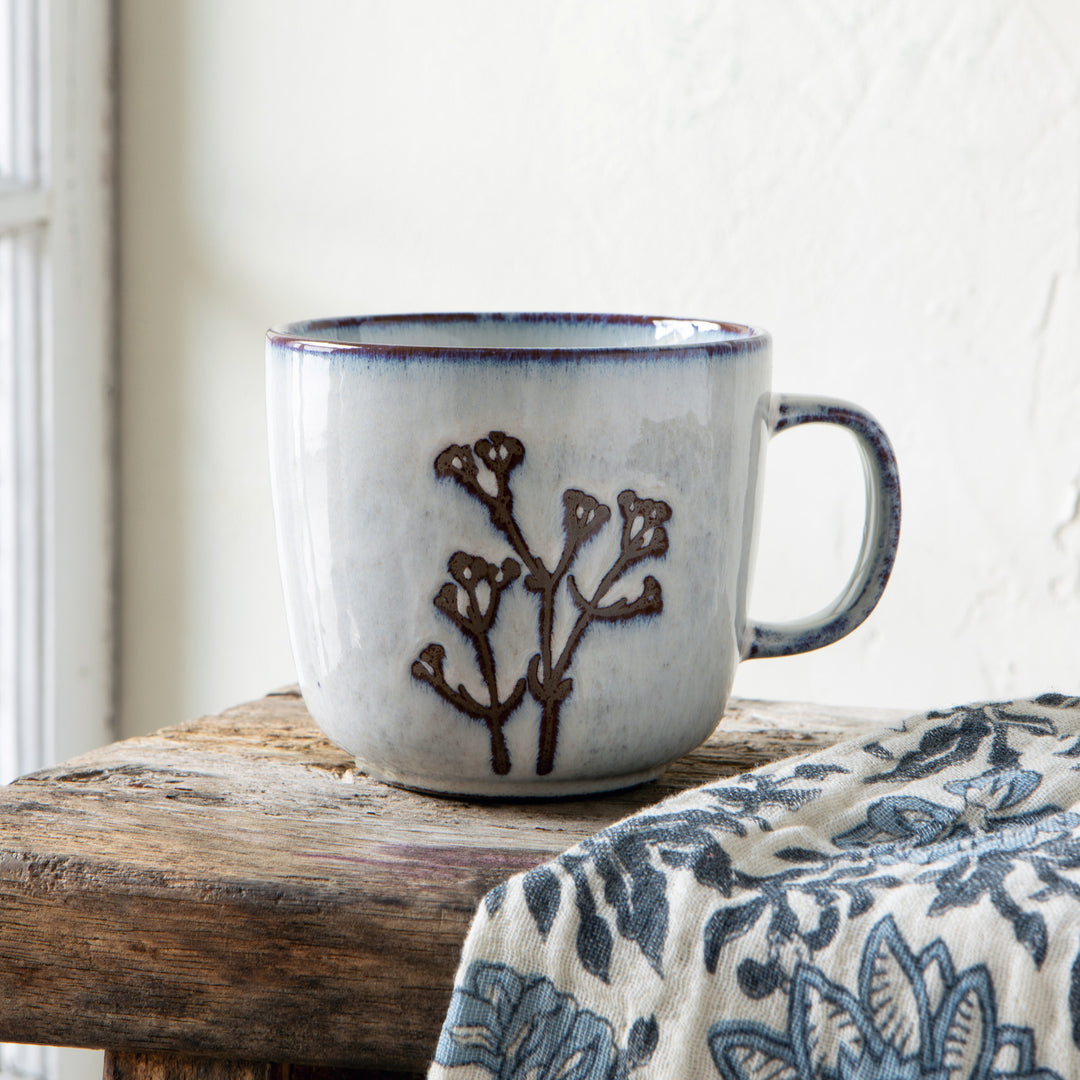Danica Revive hand-etched stoneware collection featuring intricately designed ceramic dishes and bowls with botanical detailed patterns.