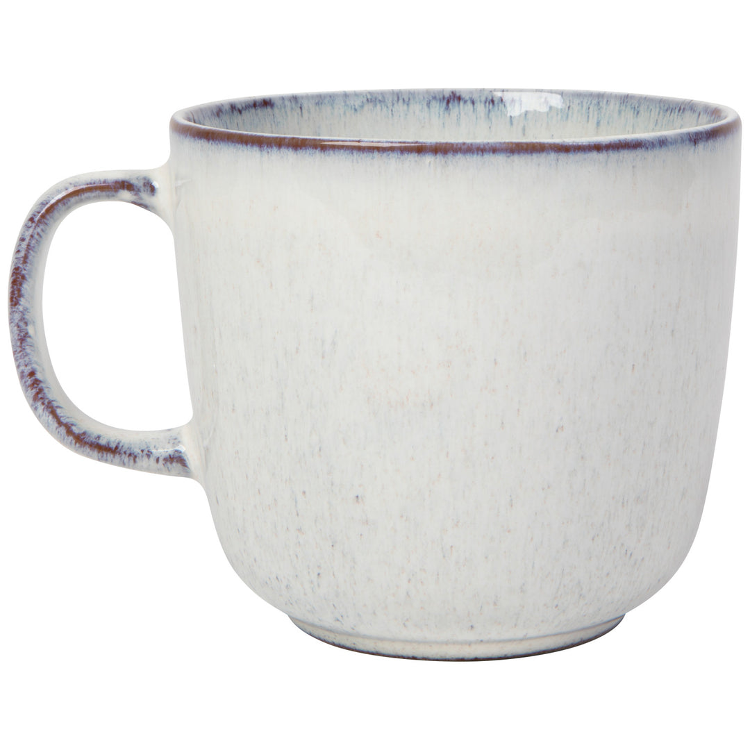 Danica Revive hand-etched stoneware collection featuring textured ceramic bowls and mugs with intricate etched designs.