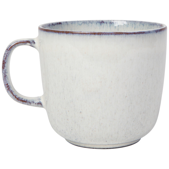 Danica Revive hand-etched stoneware collection featuring textured ceramic bowls and mugs with intricate etched designs.