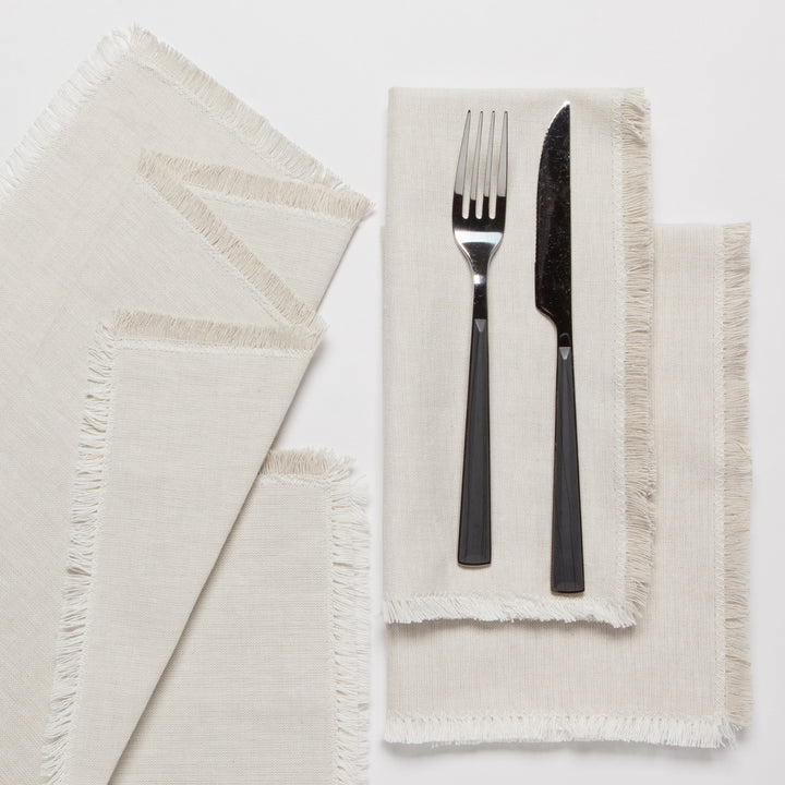 Set of Danica chambray cotton table napkins with a soft, woven texture, perfect for casual or elegant table settings.