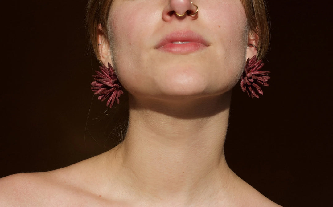 Burgundy chrysanthemum lace earring by Ilk Jewelry, showcasing intricate floral design and delicate craftsmanship.