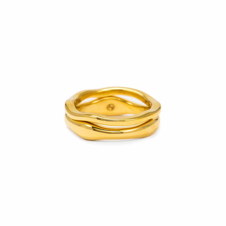 Lover's Tempo coral ring set featuring two stackable rings with gold wave bands.