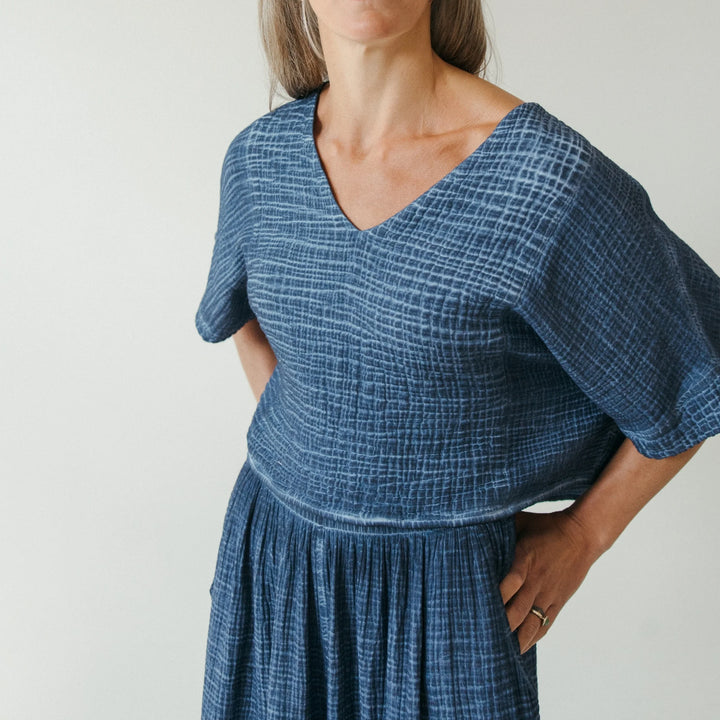 Pokoloko crinkle crop top featuring short sleeves and a textured, lightweight fabric, perfect for casual and summer outfits.