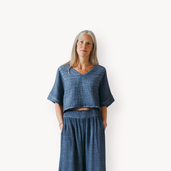Pokoloko crinkle short sleeve crop top with a textured, lightweight fabric and a relaxed fit, perfect for casual summer wear.