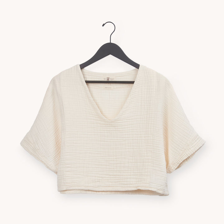 Pokoloko crinkle crop top with short sleeves, lightweight fabric, and textured finish, perfect for casual summer wear.