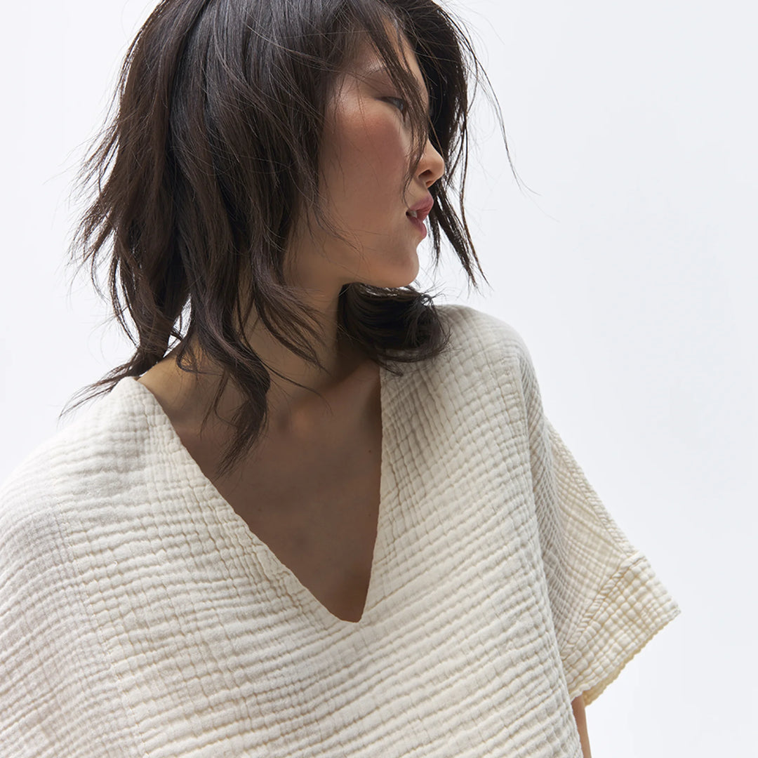 Pokoloko crinkle crop top featuring short sleeves and a textured, lightweight fabric, perfect for casual summer wear.