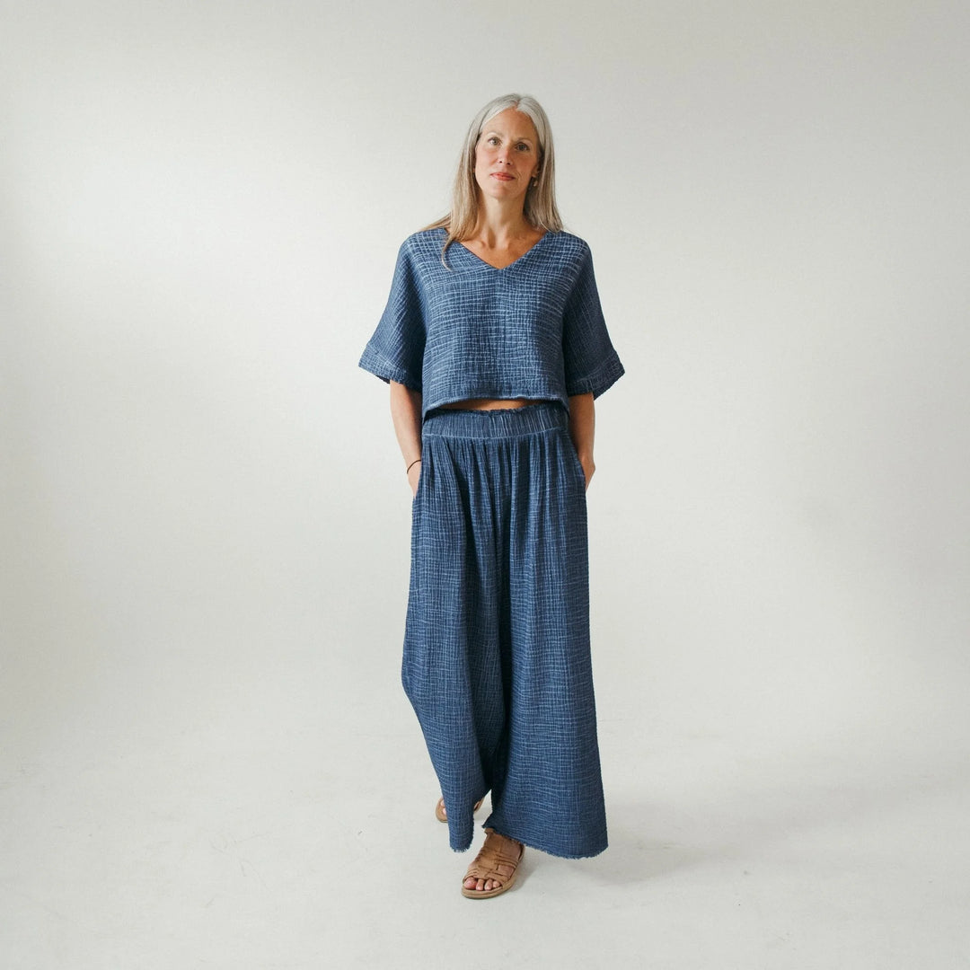 Denim crinkle palazzo pants by Pokoloko featuring wide-leg silhouette and textured fabric for comfortable, stylish loungewear.