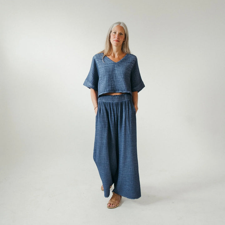 Denim crinkle palazzo pants by Pokoloko featuring wide-leg silhouette and textured fabric for comfortable, stylish loungewear.