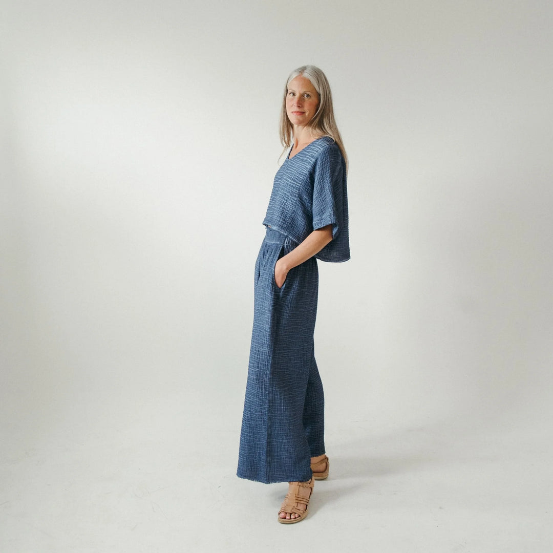 Light blue crinkle fabric palazzo pants by Pokoloko, featuring wide-leg design and comfortable loungewear style.