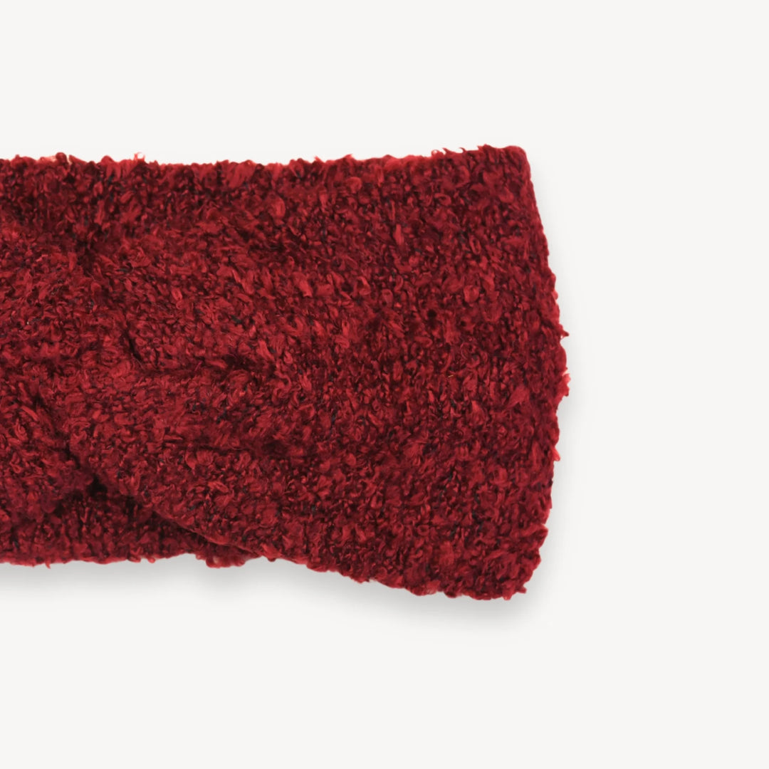 Red textured headband on a white background