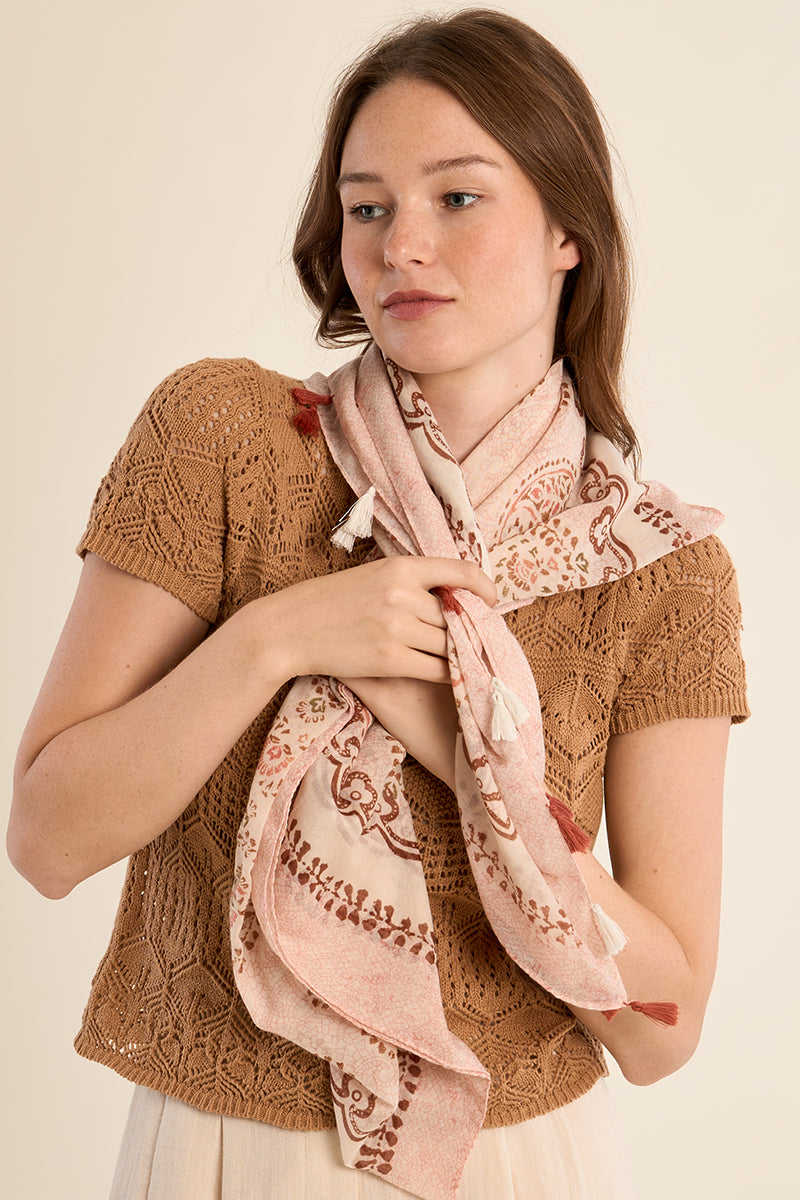 Molly Bracken Primrose Paisley scarf featuring a soft pink paisley pattern on lightweight fabric, styled with fringed edges.