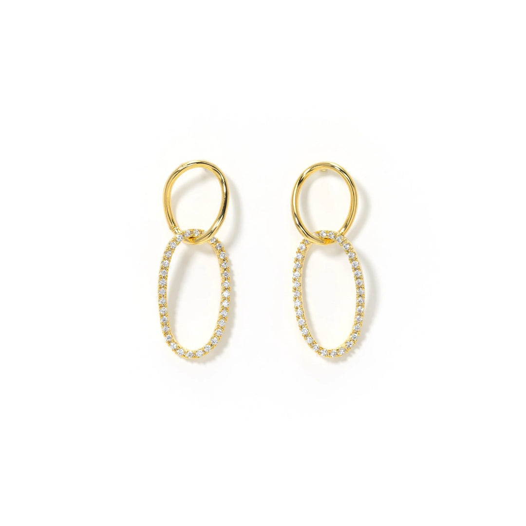 Gold hoop earrings with embedded stones on a white background