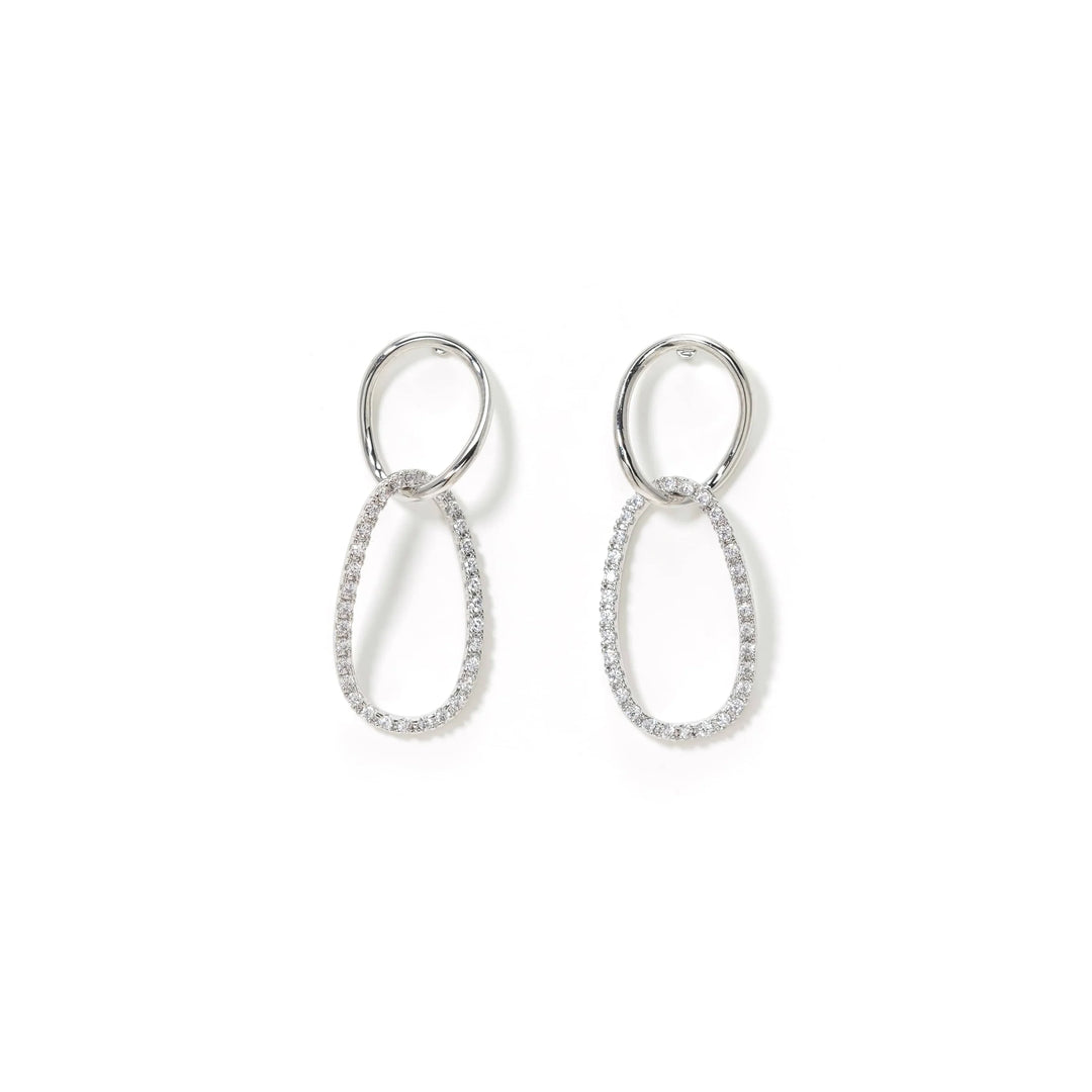 Pair of silver earrings on a white background