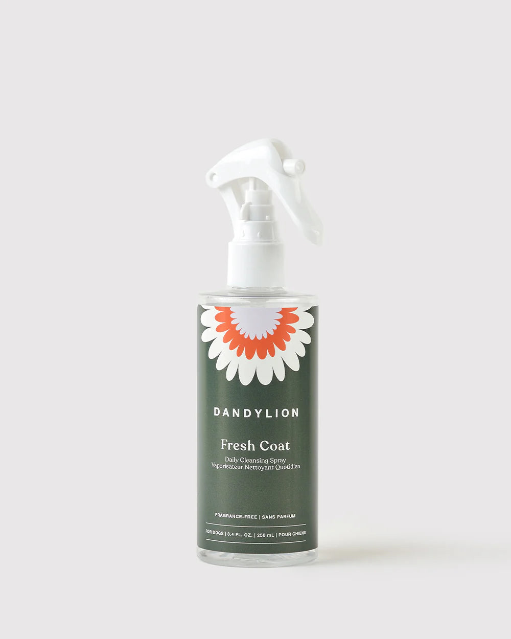 Dandylion Fresh Coat Daily Cleansing Spray, waterless pet shampoo spray showing a spray bottle with label and pet fur.