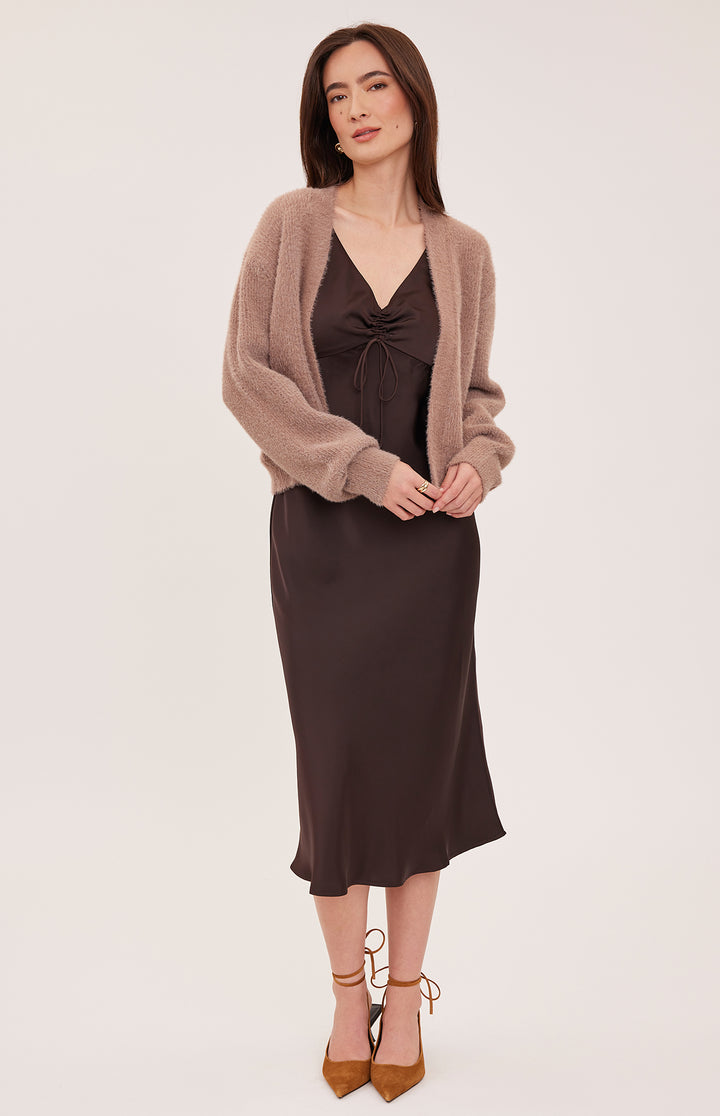 Gentle Fawn Theodora Cardigan in cocoa, soft knit fabric, shown draped on a hanger with front buttons and long sleeves.