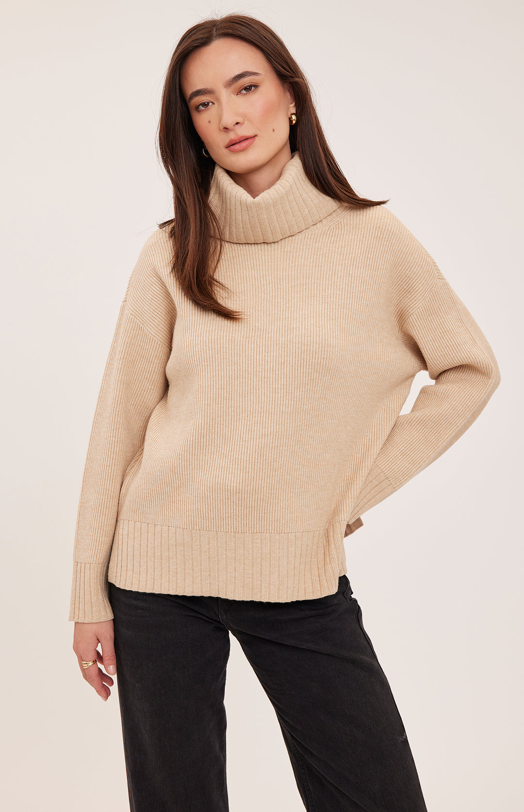 Heather gray Gentle Fawn Runa Sweater shown on a model, featuring a cozy, relaxed fit with ribbed cuffs and neckline.