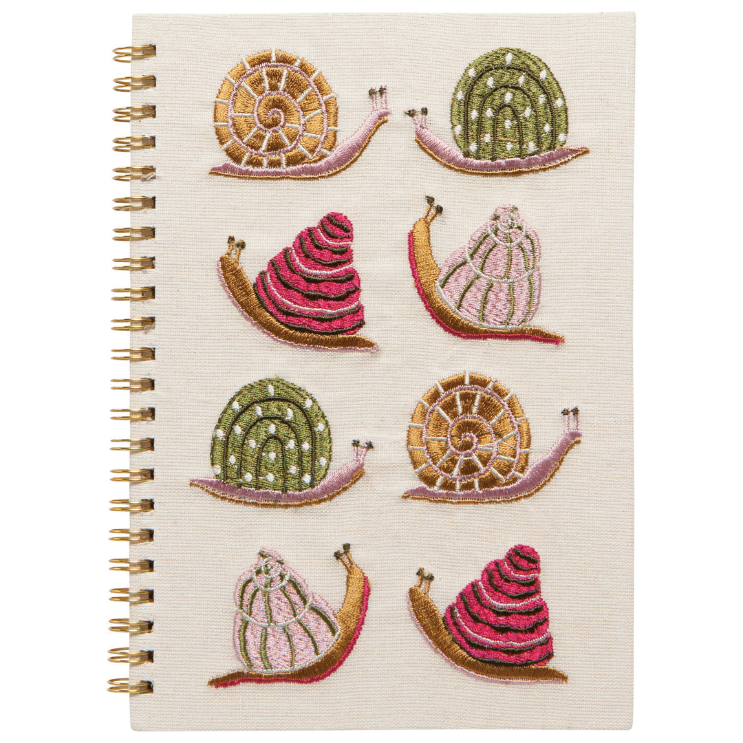 Danica Gardenland embroidered snail notepad with snail design, featuring a colorful snails on the cover.