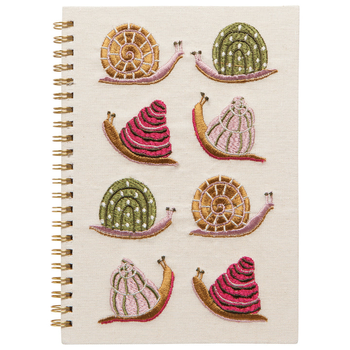 Danica Gardenland embroidered snail notepad with snail design, featuring a colorful snails on the cover.