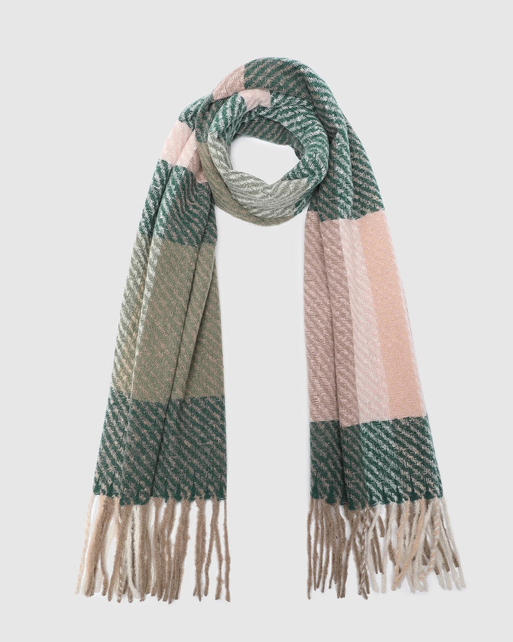 Striped scarf with green, beige, and pink colors on a light gray background