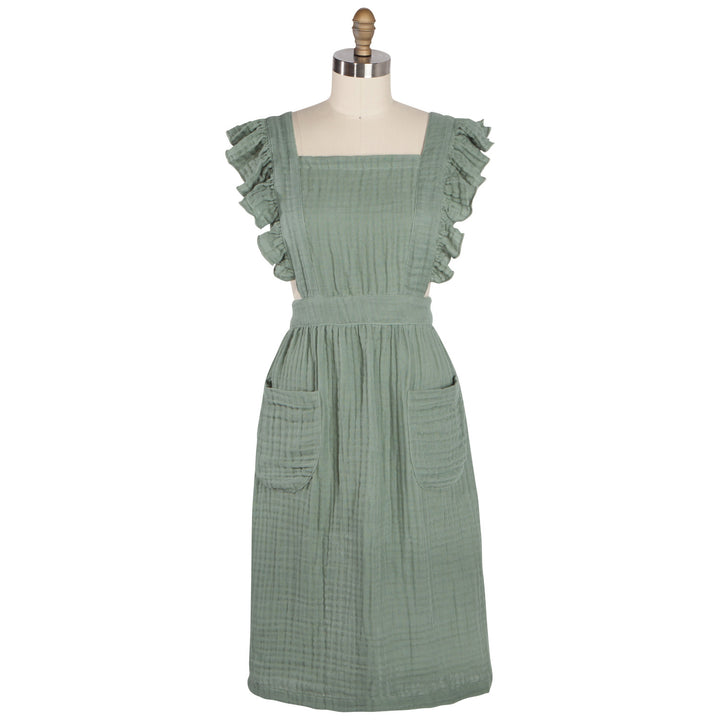 Danica Ada apron featuring a stylish, durable fabric with adjustable straps and a practical front pocket for cooking or baking.