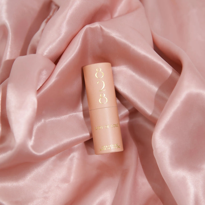 Lady of Love solid perfume by 828 Aroma Inc. in a sleek compact case, showcasing the elegant design of the solid perfume product.