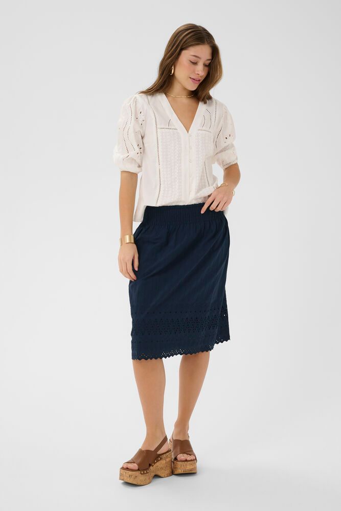 Cream Jana cotton skirt shown in soft, breathable fabric with a stylish, flowing design perfect for casual or dressy wear.