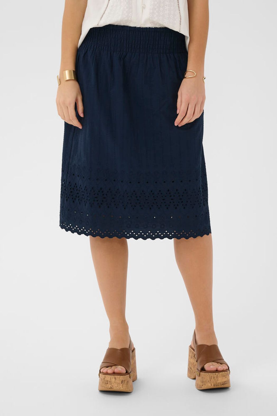 Cream Jana cotton skirt showcasing its lightweight fabric and classic knee length design for casual wear.