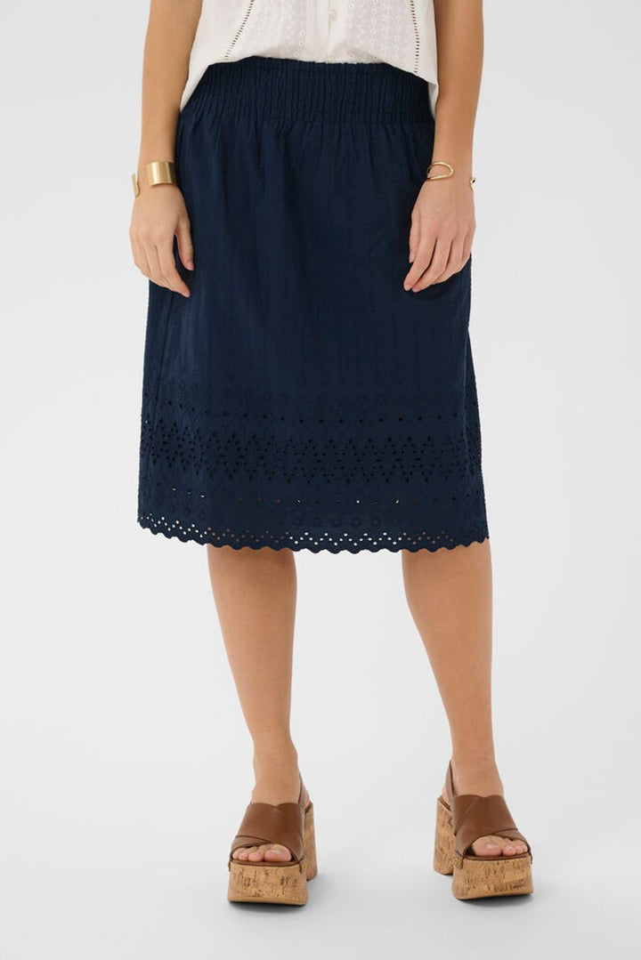 Cream Jana cotton skirt showcasing its lightweight fabric and classic knee length design for casual wear.