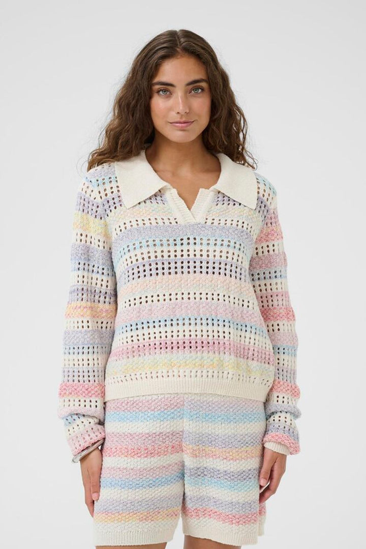 Culture Juana Knit Polo Sweater featuring a classic collar, button detail, and cozy knit stripe fabric in light pastel tones.