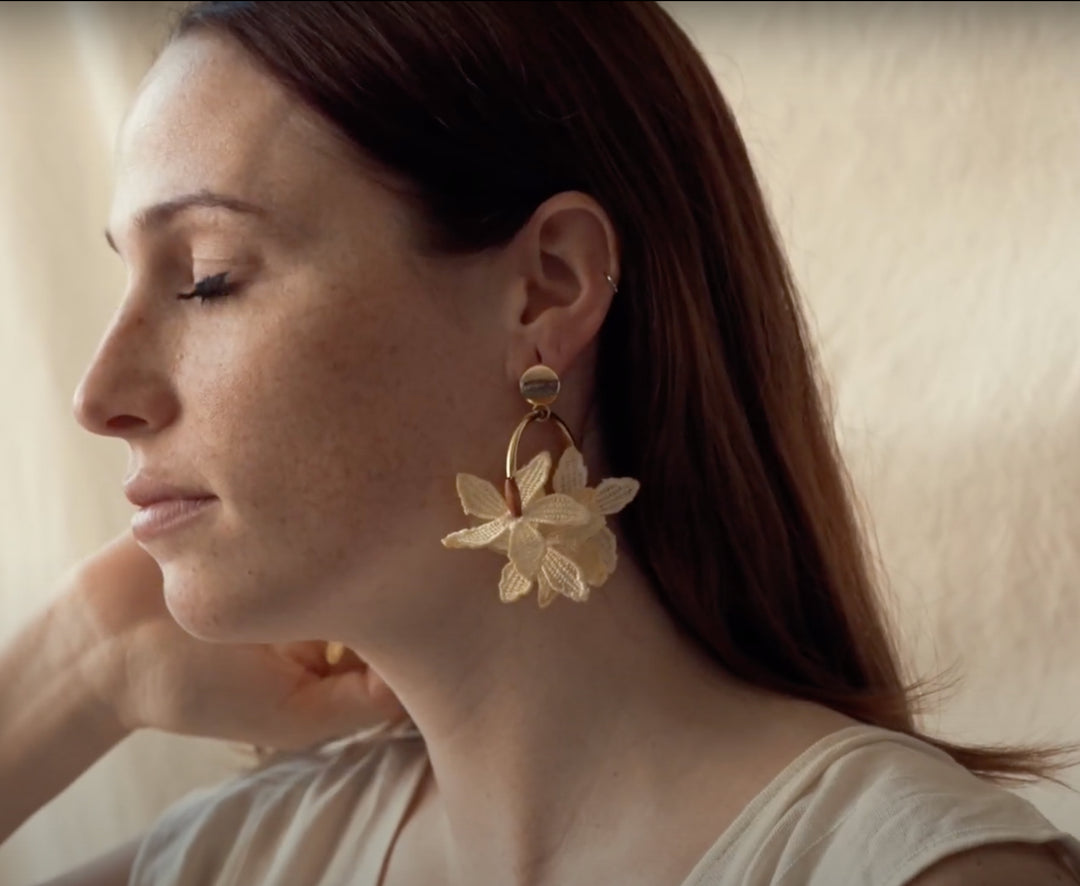Kui Lei Flower Hoop Earring by Ilk Jewelry featuring a delicate floral design in vintage lace on a circular hoop earring.