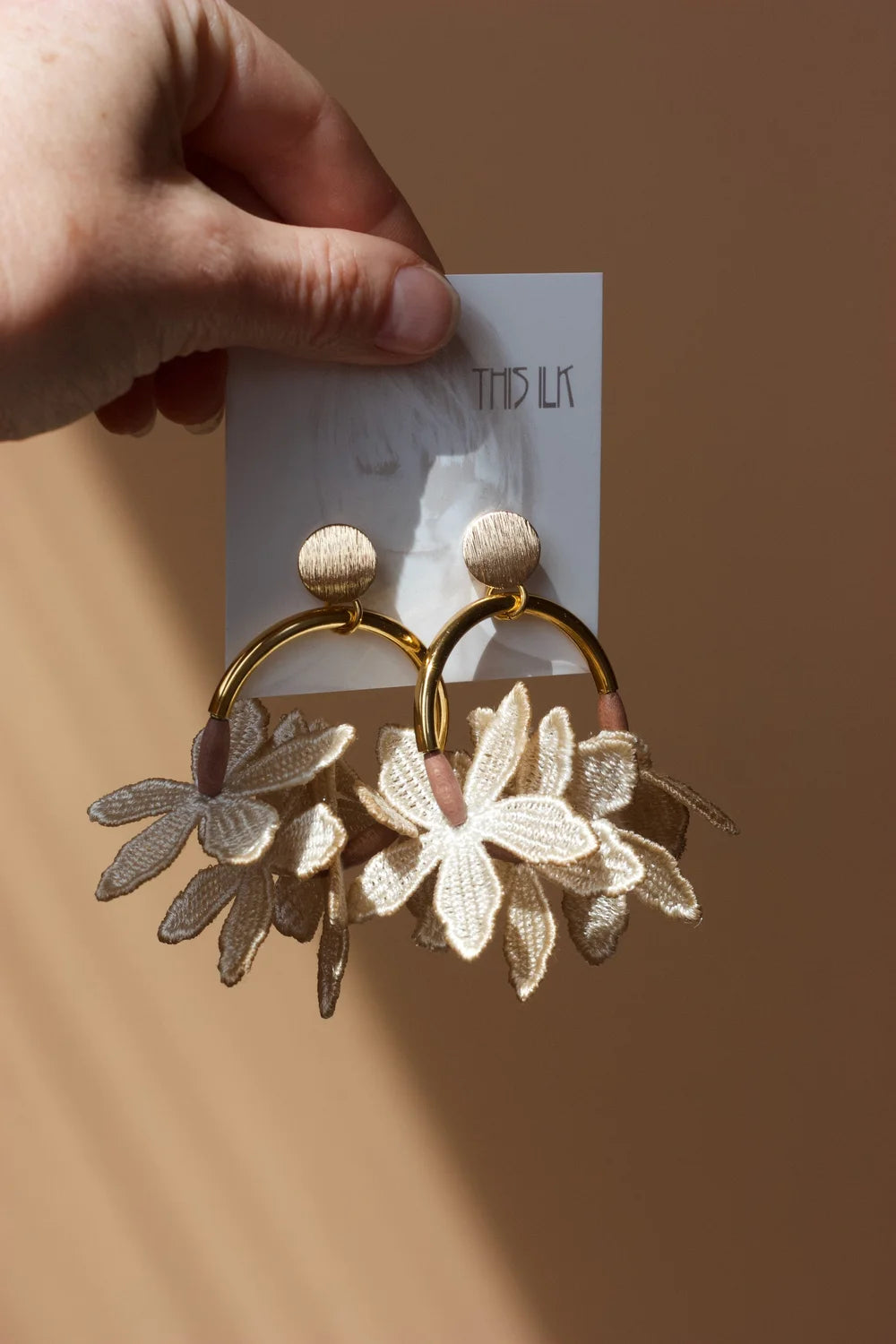 Ilk Jewelry Kui Lei Flower Hoop Earring featuring a delicate floral design in vintage lace and in gold-tone metal.