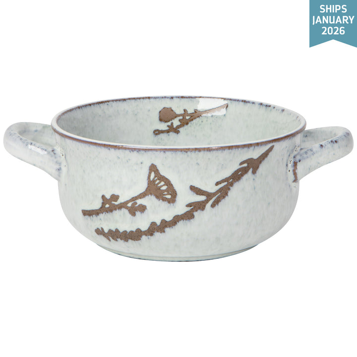 Danica Revive hand-etched stoneware collection showing a set of textured ceramic bowls and plates with intricate patterns.
