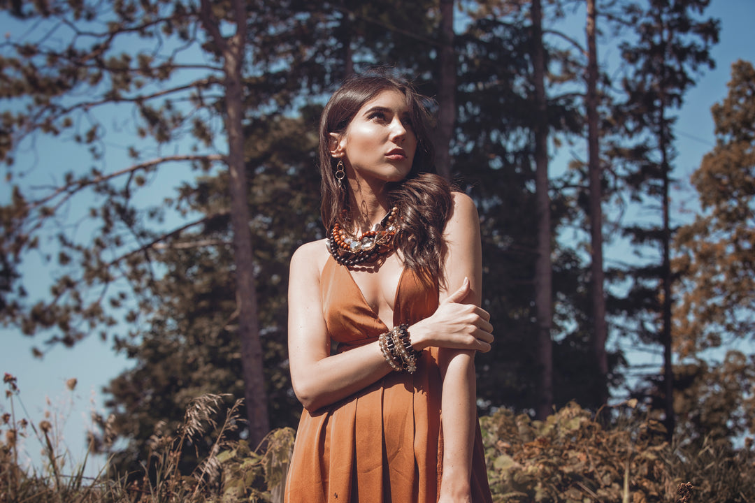 Lofttan Nay Palm Wood Necklace featuring a natural wooden pendant on a cord, showcasing unique grain and craftsmanship.