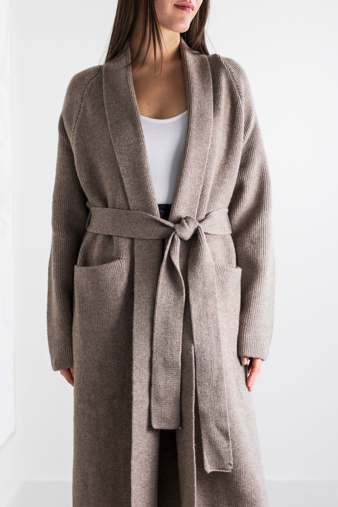 Long taupe knit cardigan with tie waist and front pockets.