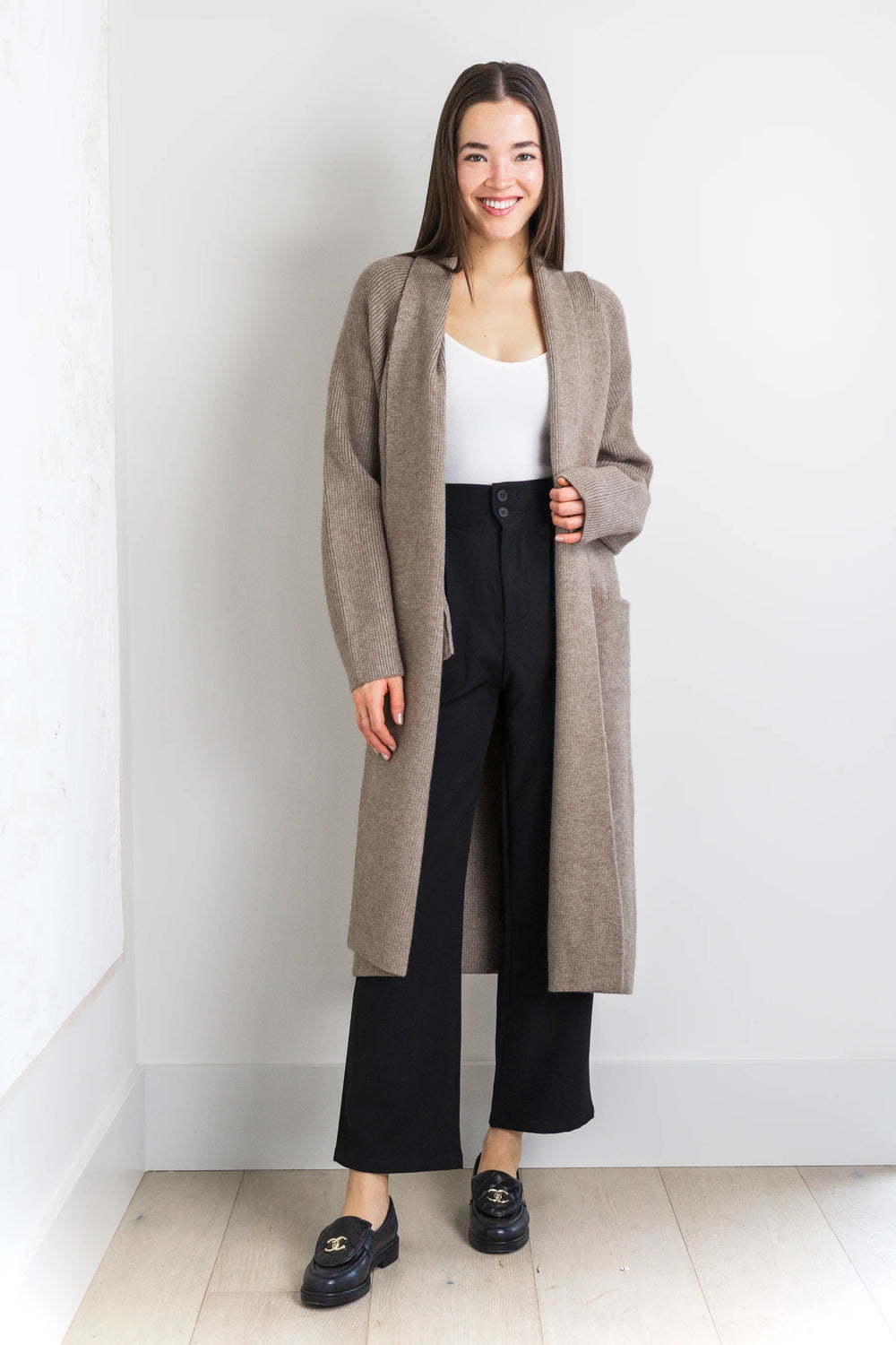 Long taupe knit cardigan with tie waist and front pockets.
