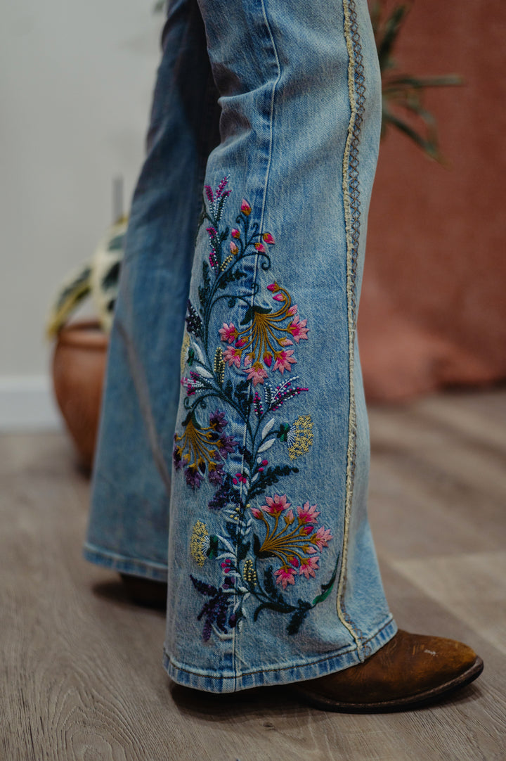 Desigual Festival Fields embroidered flare jeans with colorful floral embroidery and high-waisted fit, casual, boho, and stylish for women.