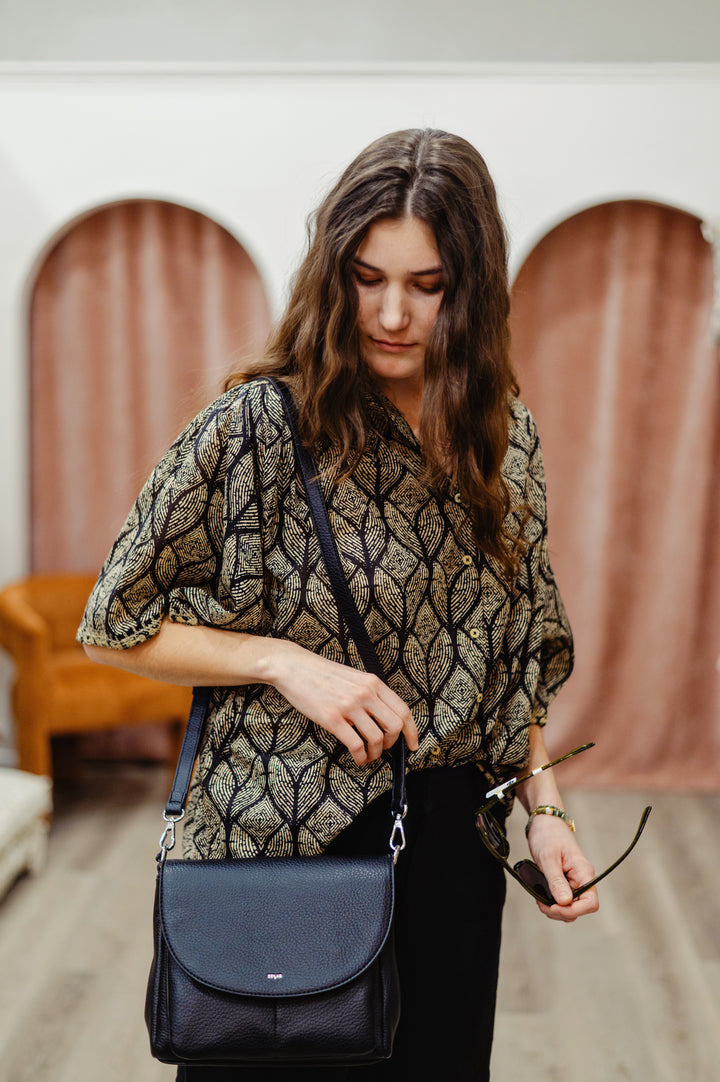 MKT Studio Cabilly blouse featuring a stylish, lightweight cotton fabric with a relaxed fit and elegant leaf  design.