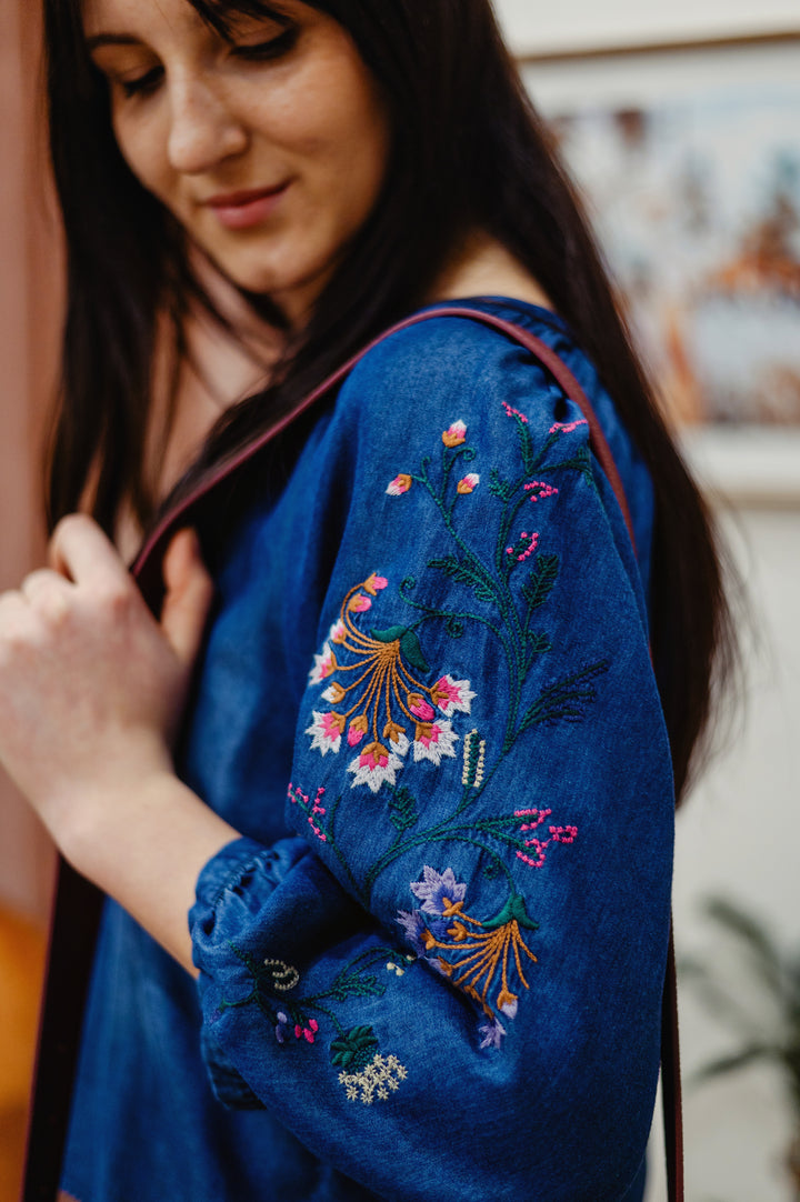 Desigual Aurora Bloom denim blouse featuring floral embroidery, casual and stylish for everyday wear.