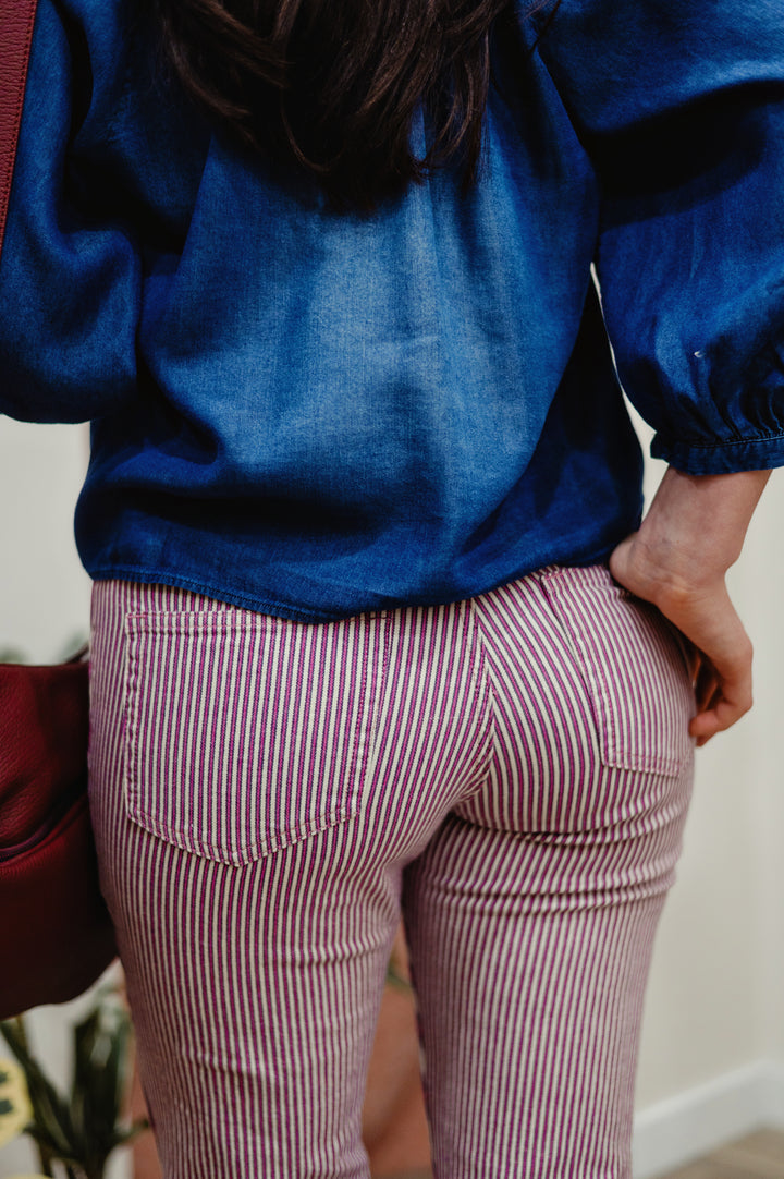 Pink Portofino striped Diana bootcut jean pant by MKT Studio, showcasing stylish denim with colorful stripe pattern, for retro boho style..