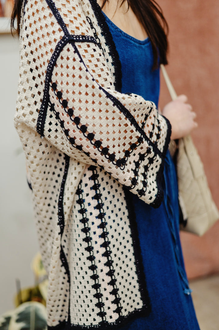 Cream Free Fly crochet kimono with open front, lightweight design, and intricate crochet pattern, perfect for layering and casual wear.