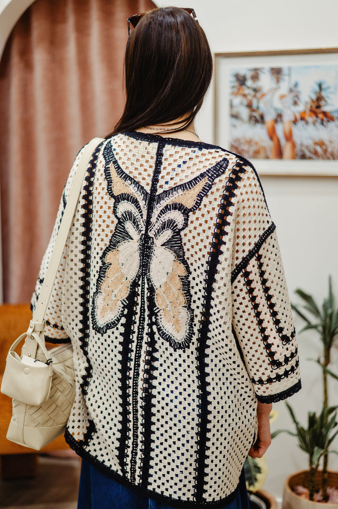 Cream Free Fly crochet kimono showing intricate open weave crochet pattern and lightweight fabric, perfect for layering with butterfly motif.