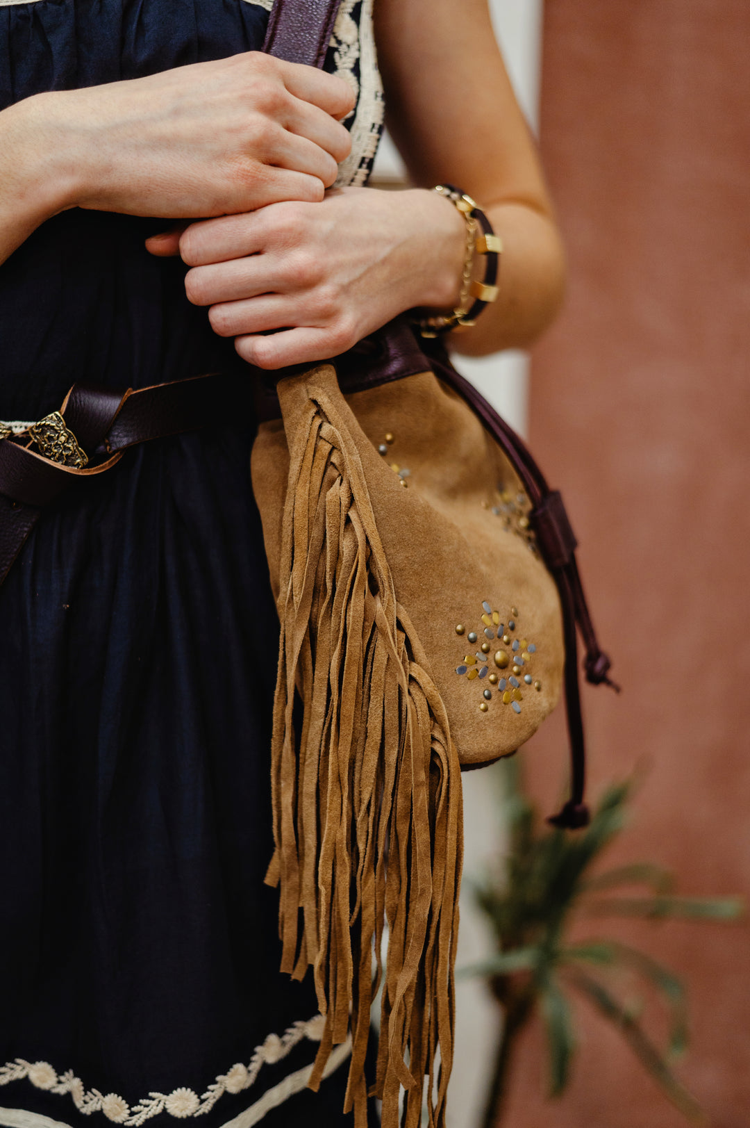 MKT Studio Bayanne leather bag with shoulder strap, featuring boho design, fringe and studs and durable craftsmanship.