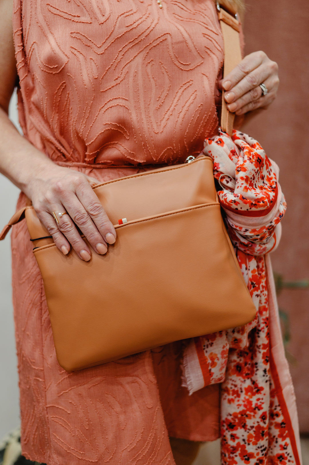 Colab Arquette Crossbody Bag with adjustable strap and stylish design, featuring a sleek silhouette and versatile storage options.