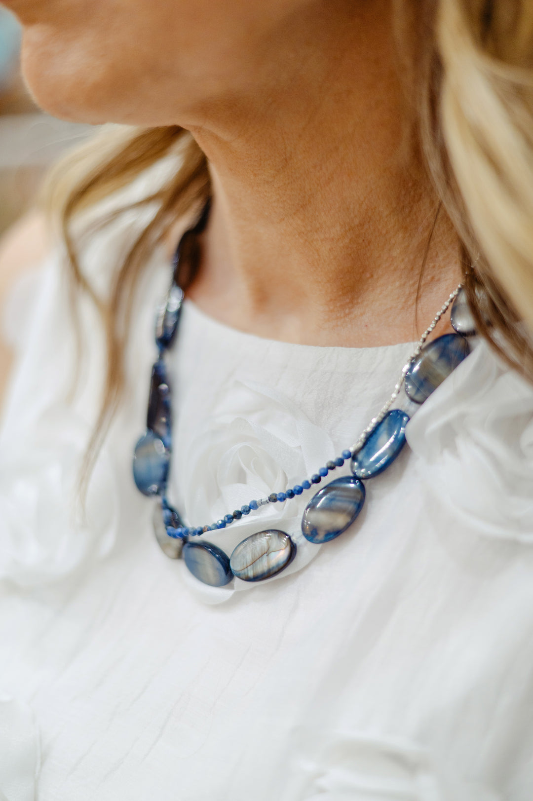 Lofttan Trent oyster shell necklace featuring a delicate chain and a natural oyster shell pendant.