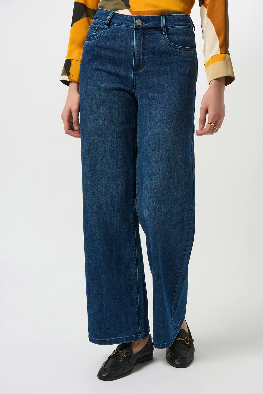 Person wearing medium blue flare jeans 