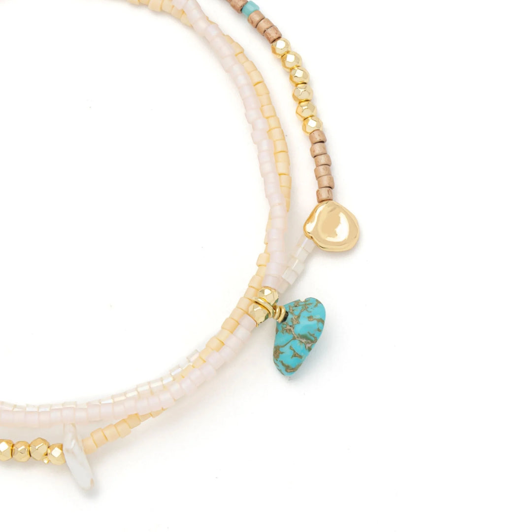 Scout mixed media beaded necklace featuring colorful beads and various textures, styled as a versatile statement jewelry piece.