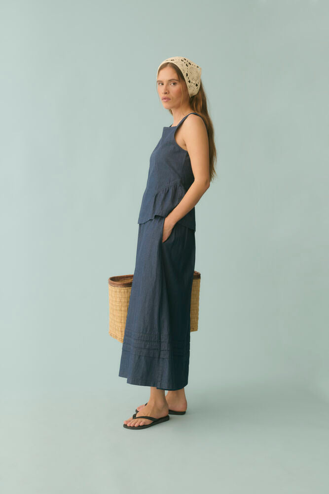 Mona Michelle sleeveless top by Culture featuring a stylish peplum design with a fitted silhouette and light weight cotton fabric.