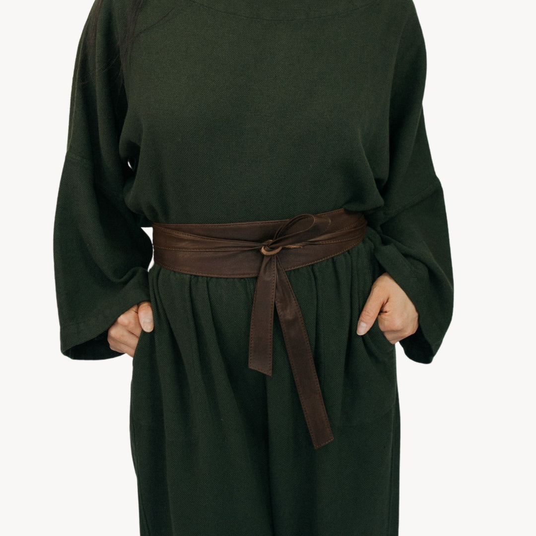 Chocolate brown leather wrap belt by Pokoloko with a sleek, adjustable design and subtle stitching details.